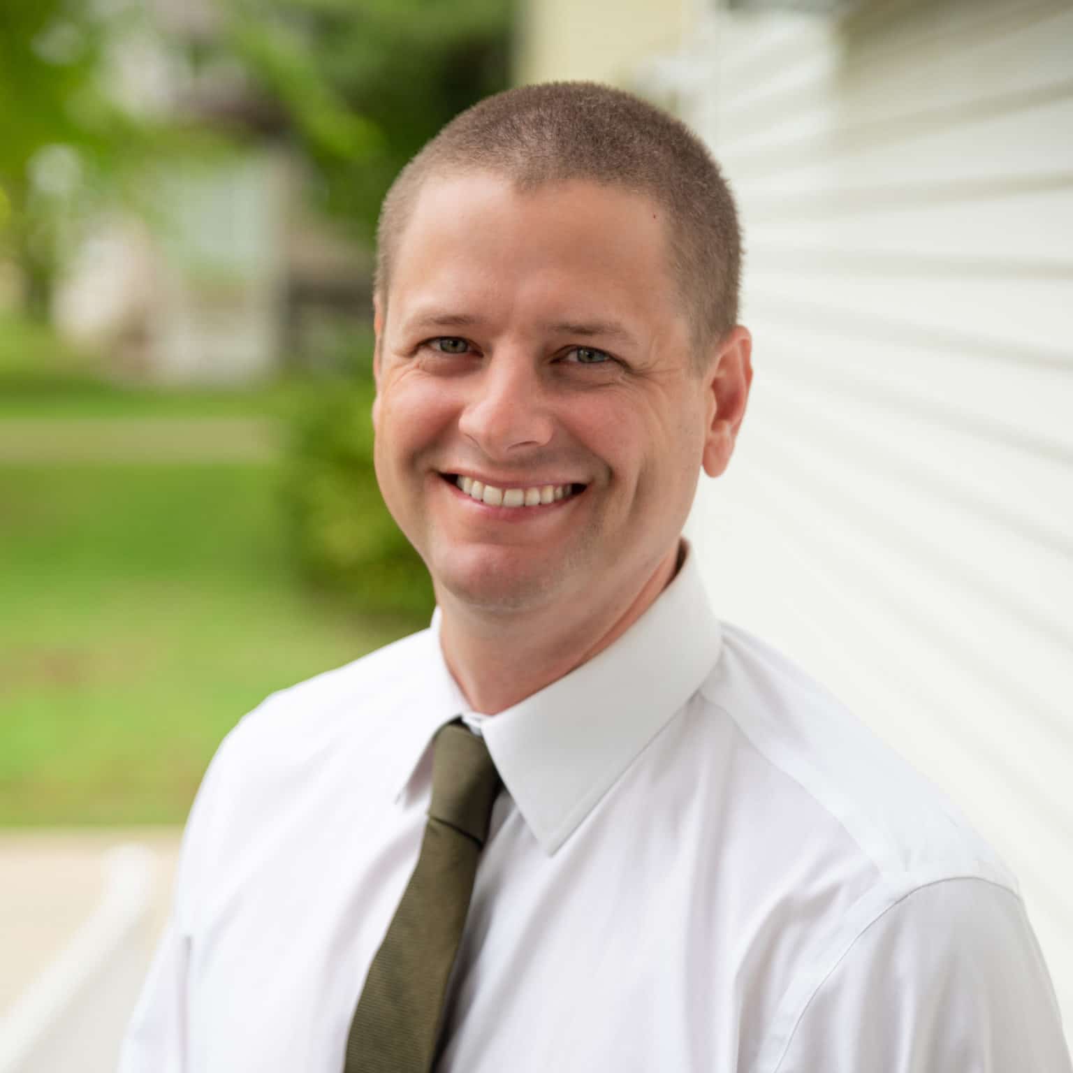 Dr. Moody, dentist in Troy, smiling for a picture at his dental office, Market Street family dental. data-lazy-srcset=